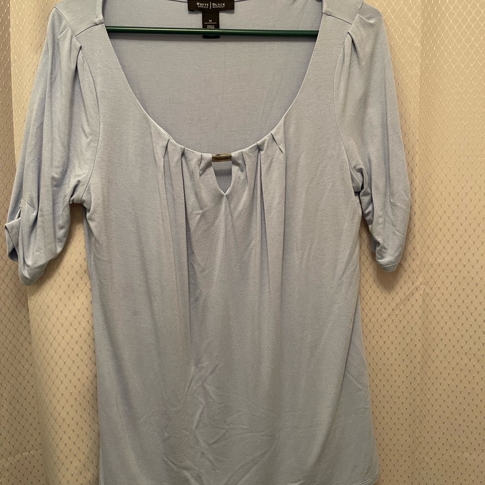 White House black market baby blue top with metal hardware on front